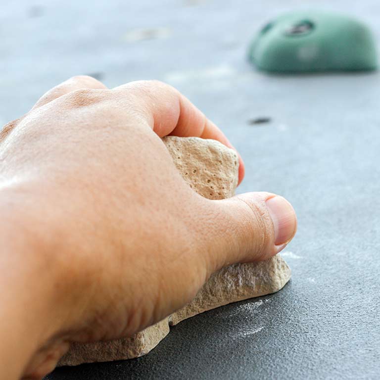 close up image of an indoor rock climbing grip