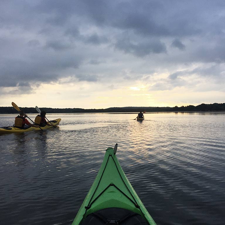 a view from inside a kayak across a lake